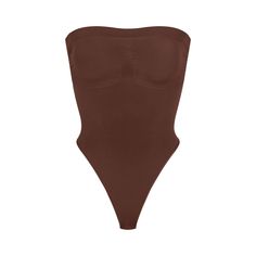 Cinch your waist and sculpt your tummy and core in this perfectly compressive strapless thong bodysuit. Wear it your way with removable adjustable straps that convert to shoulder straps, cross-back, or halter-style. Features center front and side stitching to define and support your bust, and a cotton gusset with snap closure. Fits true to size. | SKIMS Strapless Thong Bodysuit | Deep Neutral | Seamless Sculpt Sculpting Bodysuit, Strapless Bodysuit, Side Stitch, Halter Style, Wear It, Shapewear, Cocoa, Lounge Wear, How To Wear