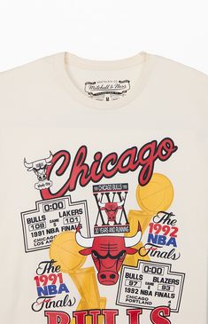 Treat yourself to a fresh pick from Mitchell & Ness with the new  Chicago Bulls Champions T-Shirt. This retro tee has a bold vibe with printed graphics on the front, a comfortable crew neckline, short sleeves, regular fit, and woven Hardwood Classics tag at the left hem.


	Crew neckline
	Short sleeves
	Standard fit
	Front graphic
	100% Cotton
	Machine washable Sports Merch, Basketball Tshirt Designs, Vintage Tshirt Design, Branding Content, Nba T Shirts, Chicago Shopping, Retro Graphic Tees, Graphic Tshirt Design, Vintage Jerseys