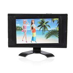 a small tv with two barbie dolls on it's screen and an image of a beach