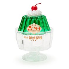 an ice cream sundae with a cherry on top in a glass dish, against a white background