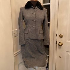 Gray Herringbone Print. Button Down Jacket. Boarder Designed Waistline. Lower Flap Welted Pockets. Button Detachable Fur Collar. Sz6p. Pencil Cut Skirt. Seam Detailing. Vented Rear Hemline. Sz 8p Cboth Fully Lined. Brand New. Excellent Condition Chic Semi-formal Winter Skirt Suit, Elegant Winter Skirt Suit With Pockets, Elegant Skirt Suit With Pockets For Winter, Gray Fitted Button-up Outerwear, Tailored Fall Skirt Suit With Buttons, Fitted Skirt Suit With Pockets For Fall, Semi-formal Winter Skirt Suit With Long Sleeves, Fitted Long Sleeve Skirt Suit For Winter, Winter Long Sleeve Skirt Suit For Semi-formal Occasions