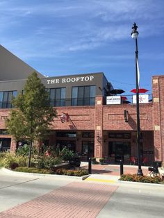 the rooftop restaurant is located in an old brick building