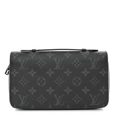 This is an authentic LOUIS VUITTON Monogram Eclipse Zippy XL Wallet. This stylish wallet is crafted of Louis Vuitton signature monogram on toile canvas in black and grey. The wallet features a smooth black leather top handle, and a polished ruthenium wrap-around zipper that opens to a partitioned black crossgrain leather interior with card slots, patch pockets, and a zipper compartment. Black Leather Top, Louis Vuitton Wallet, Leather Interior, Leather Top, Authentic Louis Vuitton, Louis Vuitton Monogram, Patch Pocket, Card Slots, Top Handle