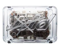 the inside of a clear plastic case with screws and other parts attached to it