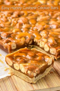 easy honey cashew cookie bars on a cutting board with one slice cut out to show the filling