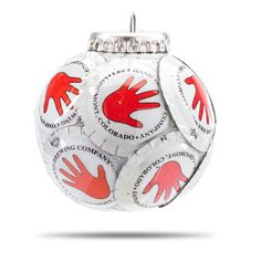 a white ornament with red hand prints on the front and back of it