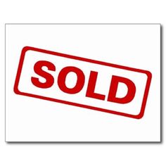 a red sold sign on a white background