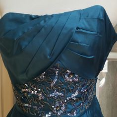 Nwt A Stunning, Vintage Betsey Johnson Dress With Form Fitting, Pleated Bodice. It Is A Teal Colored Silk Short, Strapless, Sequined Embroidered Detail At Waistline With A Pleating At Front Of Flared Skirt In Size 2 - Dress Shell Is 100% Silk With Tulle Underlay (Lining 1 Is 100% Acetate) And Lining 2 Is 100% Nylon. Zipper On Side, Measurements: Bust = 30" Waist = 23" Festive Dresses With Sweetheart Neckline, Festive Dress With Sequins And Fitted Bodice, Blue Embroidered Dress With Fitted Bodice, Festive Blue Embellished Dress, Blue Dress With Fitted Bodice For Festive Season, Embroidered Satin Party Gown, Blue Festive Dress For Party Season, Festive Embroidered Dress For Prom, Embellished Blue Silk Gown