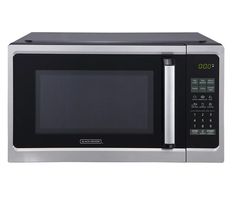 a stainless steel microwave oven with the door open and timer on it's side