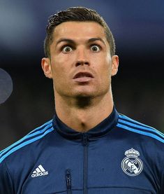 the soccer player looks surprised as he stands in front of an empty ball during a match