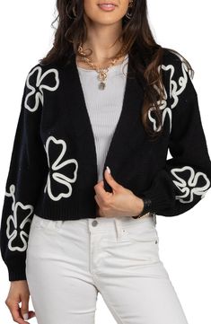 Swirling floral trim highlights a slouchy open-front cardigan fashioned in a sweetly cropped silhouette. 18" length Open front Long sleeves 100% acrylic Hand wash, line dry Imported Model stats: 5'10" height, 32" bust, 25" waist, 36" hip. Model is wearing size One Size. Black V-neck Cardigan For Spring, Trendy Black Spring Cardigan, Black Open Front Sweater For Spring, Checker Crochet, Colorblock Crochet, Checkered Crochet, Flower Cardigan, Coat White, Crop Cardigan