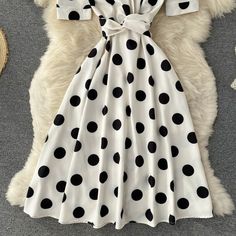 Cute polka dot v neck short dress fashion dress Fabric: blended Color: black, white Size(cm): S, M, L, XL S length 105 bust 80 waist 68 M length 106 bust 84 waist 72 White V-neck Short Sleeve Party Dress, Trendy Polka Dot Dresses For Summer, Trendy White A-line Dress, Trendy Polka Dot Summer Dress, Summer V-neck Polka Dot Midi Dress, Chic A-line Polka Dot Dress, Elegant Polka Dot V-neck Midi Dress, V-neck Polka Dot Mini Dress For Summer, V-neck Mini Dress In Polka Dot For Summer