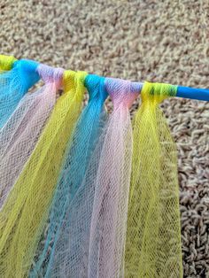 colorful net hanging from a clothes line on carpet