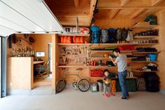 a man standing next to a child in a garage