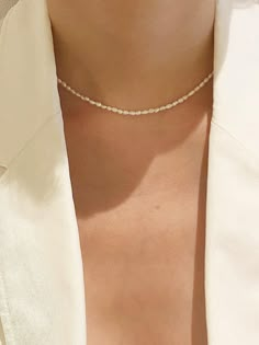 - Pearl choker necklace- Extension chain- Lobster claw claspMeasurements- Length: 15.5in- Extension chain: 0.7in- Pearl: 0.11in*0.15inComposition - Freshwater pearlDesigner- Made in Korea- by nuavo- Style# 300988110 Modern Pearl Necklace Design, Modern Pearl Necklace, Wedding Choker Necklace, Small Pearl Necklace, Tiny Pearl Necklace, Dainty Pearl Necklace, Pearl Necklace Designs, Chocker Necklace, Pearl Choker Necklace