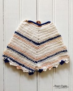 a crocheted skirt hanging on the wall