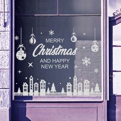 a window with a merry christmas and happy new year sign