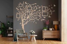 a living room with a tree and pictures on the wall