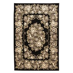 a black rug with white flowers and leaves on it, in front of a white background