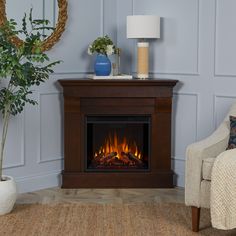 a living room with a chair and a fire place in the corner on carpeted floor