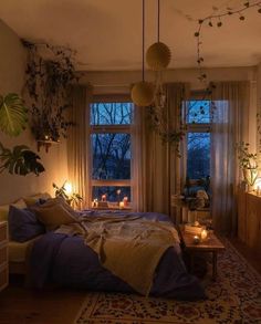 a bed room with a neatly made bed and lots of plants on the windowsill