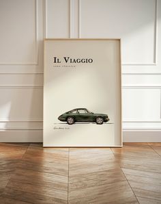 an old car is displayed in front of a white wall with the words ill viago on it