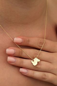 14k Gold Koala Australian Animal Charm Necklace, Minimalist Dainty Koala Necklace, Koala Christmas Gift for Her, Animal Jewelry Koala is a symbol of faithfulness, gentleness, and peace.   FEATURES * Solid Gold (real gold, not gold plated or gold filled material) * Gold Karat: 10K (417) - 14K (585) - 18K (750) (optional) * Pendant Height: 0.53 Inches (1.34 cm) * Pendant Width: 0.56 Inches (1.43 cm) * Available Gold Color: Yellow gold, rose gold and white gold (optional) * Diamond weight: 0.01 ct Cute Yellow Gold Jewelry Gift, Cute Gold Necklaces For Mother's Day, Cute Gold Necklace For Mother's Day, Cute Gold Pendant Jewelry, Cute Gold Jewelry For Christmas, Cute Gold Pendant Necklace, Cute Gold Jewelry As Gift For Mom, Cute Gold Jewelry For Mom's Gift, Cute Gold Jewelry Gift For Mom