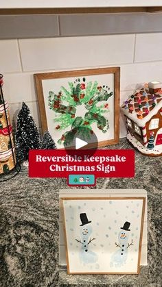 a table topped with christmas cards and framed pictures