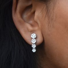 "Perfect diamond earrings for your wedding day - simple and elegant! Illusion set diamonds giving the look of solitaires, depicting the journey of life. * Diamond Wt. : 1.05 Cts * Color-Clarity Grade : H-I, Vs-Si * Gold - 18k, 5 gms White Gold * Dimension : 20 mm (approx) Bridal - Diamond Cluster - Illusion Set - Journey - 18K White Gold If you like this ring, please press \"Pin it\" button on the right of your screen. Find us on Instagram for exquisite designs: @abhikajewels Like us on Facebook Wedding Linear Dangle Earrings With Brilliant Cut, Brilliant Cut Dangle Linear Earrings For Wedding, Classic Diamond White Linear Earrings For Wedding, White Gold Linear Earrings With Prong Setting For Wedding, Brilliant Cut Linear Earrings For Wedding, Wedding Diamond Linear Earrings With Brilliant Cut, Brilliant Cut Diamond Drop Earrings For Anniversary, Minimalist Halo Diamond Earrings For Formal Occasions, Minimalist Formal Diamond Earrings With Halo Design