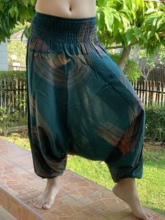 "⬇️ SHOP HERE https://www.etsy.com/ch-en/shop/IndycraftsDesigns Aladdin Pants, Harem Pants 100% Cotton Unisex pants, perfect for yoga, The pants have smock waist (wide bang elastic) The fabric is cotton soft, lightweight, and airy, ideal for those warm days. If it's a bit chilly, you could always wear leggings underneath. super comfortable cotton pants made of light, comfortable to wear cotton. The ideal pants for leisure, sport and wherever it should be loose and comfortable *Special features: Cotton Harem Pants, Yoga Trousers, Unisex Pants, Womens Pants, Cotton Pants, Aladdin, Special Features, Smocking, Harem Pants