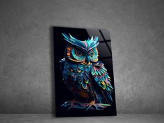 an owl with colorful feathers is shown on a black canvas against a gray wall,