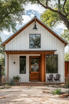 Modern barndominium exterior with metal siding, wood accents, large windows, and gable roof Home Building