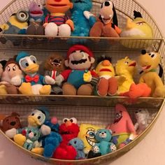 several shelves filled with stuffed animals on top of each other