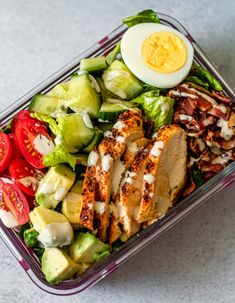 cobb salad meal prep with chicken, lettuce and tomatoes