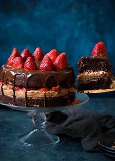 a cake with chocolate frosting and strawberries on top