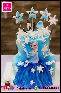 a frozen princess birthday cake with snowflakes and stars