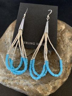 * Beautifully Handmade and original these Blue Turquoise Dangle Liquid Silver Heishi Earrings can add a look of elegance with any casual attire. * They are in Sterling Silver. * Length 2" * Free Gift Pouch with Purchase * Made in USA Please contact seller for any questions and concerns. We hope you have a great experience with us and hope for an awesome review. Blue Sterling Silver Chandelier Earrings With Ear Wire, Southwestern Blue Earrings For Pierced Ears, Blue Nickel-free Long Drop Teardrop Earrings, Southwestern Style Blue Earrings For Pierced Ears, Blue Long Drop Jewelry With Dangling Beads, Southwestern Blue Drop Earrings, Southwestern Style Blue Pierced Earrings, Southwestern Style Blue Drop Earrings, Blue Long Drop Chandelier Earrings