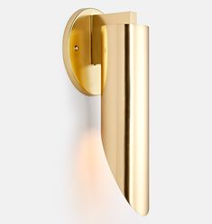 an image of a modern wall light with gold finish on the outside and white background