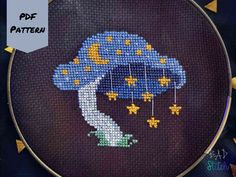 Celestial Mushroom Cross Stitch Pattern - PDF Download This is a cross stitch pattern of a celestial themed mushroom. There's light backstitching that connects small stars to the mushroom cap.  Consider using DMC etoile or metallics for the stars to make the project shimmer! Pattern Notes 62w x 55h 1,186 full cross stitches + 7 backstitch 9 DMC Colors, including DMC Etoile Backstitch indicated in PINK Finished Sizes On 14ct: 4 1/2 x 4 inches (11.2 x 10 cm) On 16ct: 3 3/4 x 3 1/2 inches (9.8 x 8.