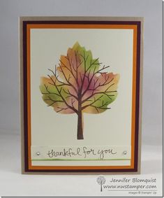 a handmade card with a watercolor tree on it's front and the words, thank you