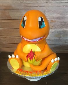 a cake shaped like a cartoon character sitting on top of a plate