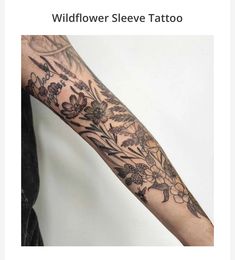 a woman's arm with flowers on it and the words wildflower sleeve tattoo