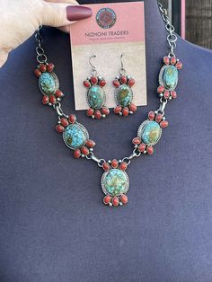 New without tags BRAND : Sterling JEWELRY TYPE : Necklaces MAIN STONE : Multi-Stone METAL : Sterling Silver ARTISAN : Kathleen Chavez I can’t believe this piece from our Taos Collection. Incredible Hand Crafted Navajo Sterling Silver with Natural Coral and Kingman Turquoise Necklace . Measuring 20 inches long. Beautiful Kingman Turquoise and Natural Red Coral Stones on 5 Pendant Pieces. Matching Dangle Earrings are 2 inches long and 3/4 of an inch wide. Signed by Artist Kathleen Chavez. Stamped Southwestern Gemstone Jewelry Gift, Southwestern Gemstone Jewelry For Gifts, Southwestern Style Gemstone Jewelry For Gift, Southwestern Gemstone Jewelry For Gift, Southwestern Oval Jewelry For Jewelry Making, Red Southwestern Style Collectible Jewelry, Bohemian Red Jewelry With Gemstone Accents, Southwestern Multi-stone Turquoise Jewelry, Southwestern Jewelry With Large Stone For Gifts