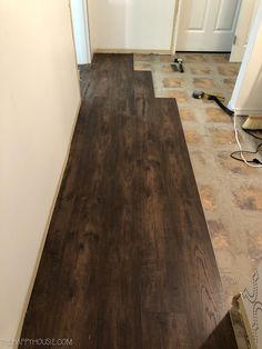 the floor is being installed and ready to be installed in the kitchen or living room