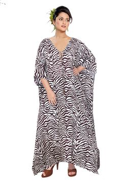 Elegantly decorated Zebra stripe print Maxi long Kaftan gown with lace up neck embroidered beads heading outline silk caftan tops Exclusive Persona you may carry with this kaftan dress hooking up the evergreen zebra print It outlines our worldly treasure of zebra breed with its striped outline all over the gown. Whether clubbing up with accessories or keeping it as it is you will stand out from the followings and grab the attention of people around you. Have it today itself... - One Size Fits Al Bohemian Striped Long Sleeve Kaftan, Striped Long Sleeve Bohemian Kaftan, Bohemian Striped Kaftan For Beach Cover-up, Spring Striped Kaftan For Beach Cover-up, Striped Long Sleeve Kaftan For Vacation, Silk Kaftan Gowns, Kaftan Fashion, Women Silk Dress, Embroidered Beads