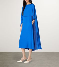 Find VALENTINO Silk Cape Midi Dress on Editorialist. Valentino never fails to deliver elegant silhouettes and premium fabrics, and this fluid mini dress is no exception. Cut from a lightweight silk crepe, it features a flowing cape bodice layered over a midi-length hem. Take it to the next level with opulent jewellery and statement shoes at your next soirée. Blue Midi Dress With Draped Sleeves For Evening, Blue Formal Dress With Cape Sleeves, Blue Formal Dresses With Cape Sleeves, Blue Midi Dress With Draped Sleeves, Blue Maxi Dress With Cape Sleeves, Blue Midi Dress With Draped Sleeves For Cocktail, Chic Blue Midi Dress With Draped Sleeves, Blue Pre-draped Dress For Spring, Chic Blue Dresses With Cape Sleeves