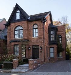 a large brick house with many windows