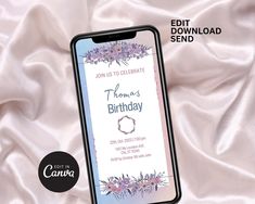 an iphone with the text happy birthday on it next to a white satin background and purple flowers