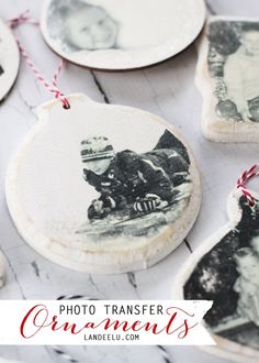 christmas ornaments with an old photo hanging from the front and side on a wooden table