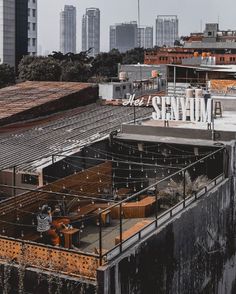 an industrial area with lots of tall buildings in the background